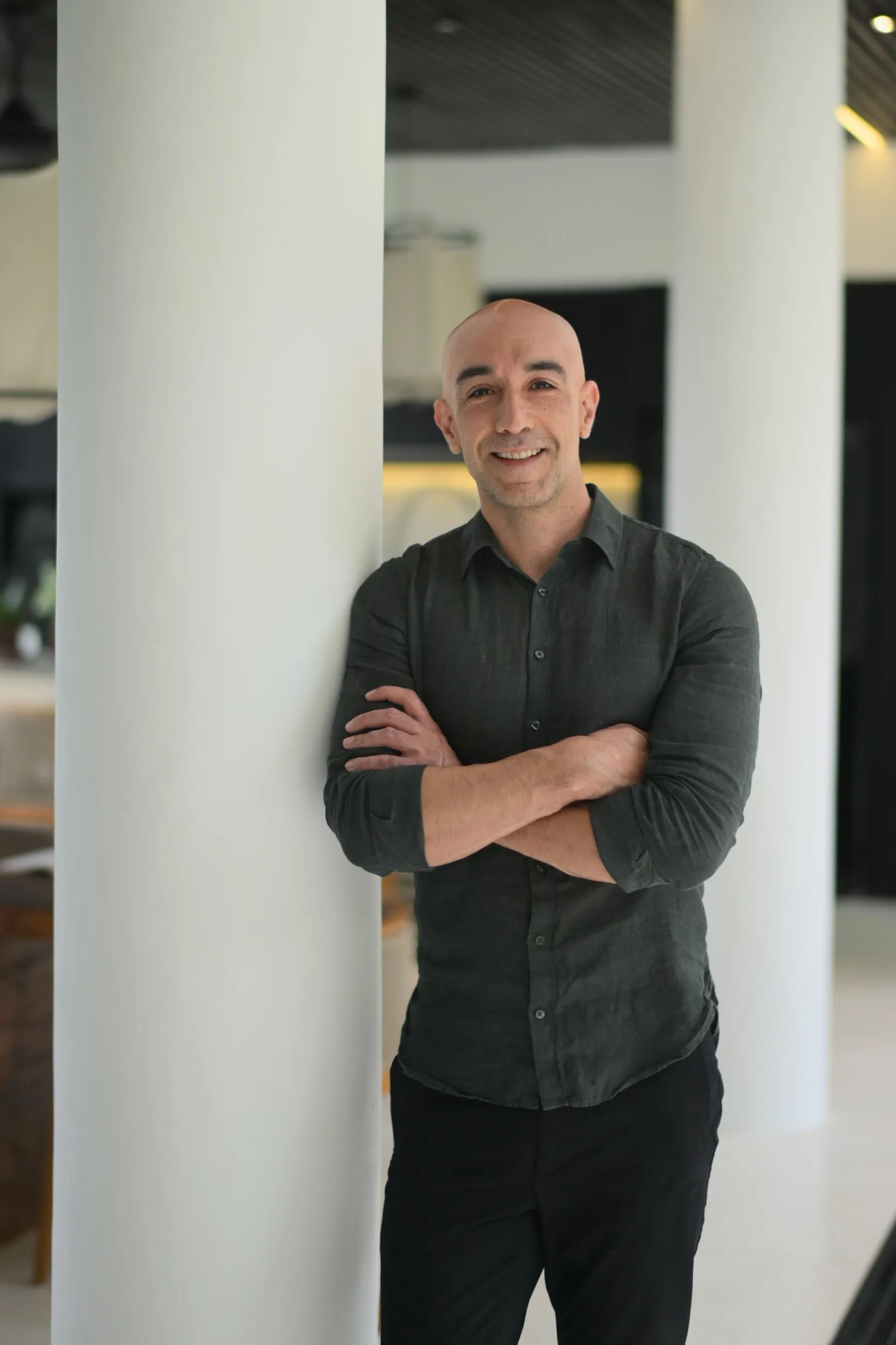 Breathwork facilitator Mike McGregor standing with his arms folded, smiling